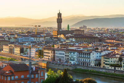 View of florence in italy at sunset by the arno river