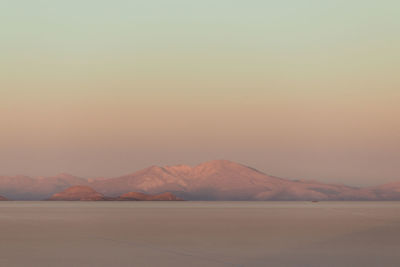 Scenic view of mountains against sky during sunset