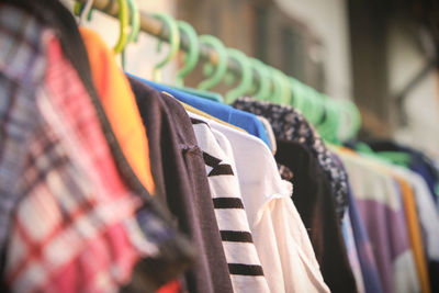 Clothes hanging on rack at store