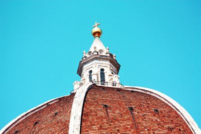 Low angle view of building against clear blue sky