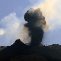 Scenic view of volcanic mountain against sky