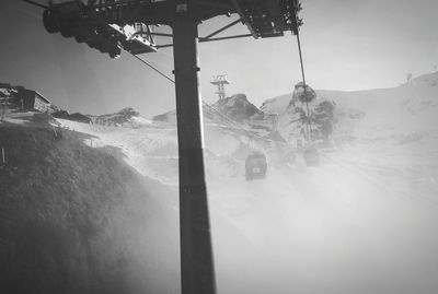 Overhead cable car against sky during winter