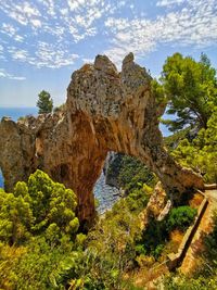 Rock formation on rocks against sky