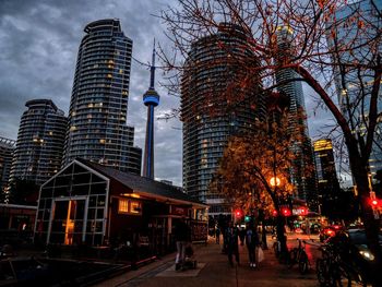 Illuminated buildings in city at dusk