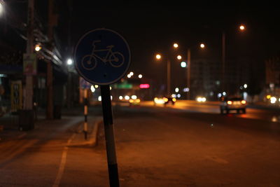 Illuminated city street at night