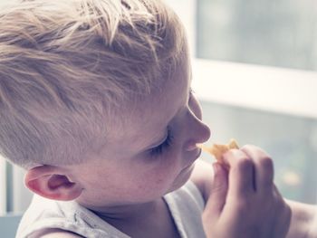 Close-up of boy eating food