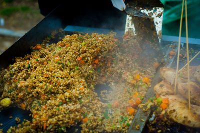 Spatulas in food at market stall