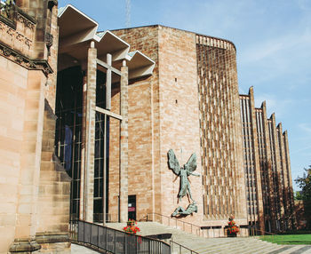 Low angle view of statue against building