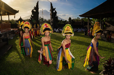 Balinese rejang dancer are dancing around the tanah aji temple at karangasem regency