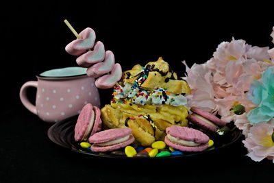 Close-up of various flowers in plate on table