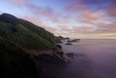 Scenic view of sea against sky at sunset