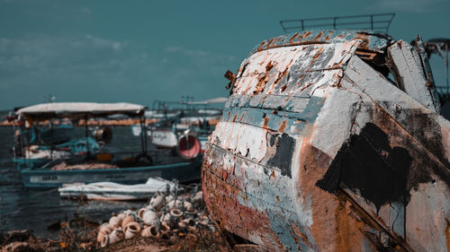 Abandoned boats on shore