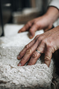 Cropped hand of person preparing food