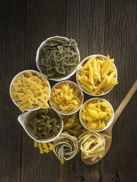 Close-up of various pasta in bowls on table