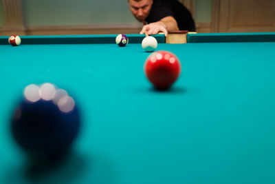 Cropped hand playing pool