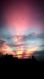 Silhouette landscape against dramatic sky