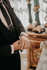 Midsection of businessman playing chess