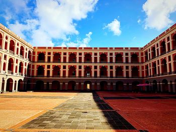 View of historical building against cloudy sky