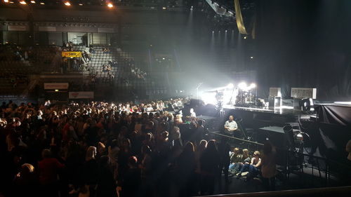 Group of people in concert at night