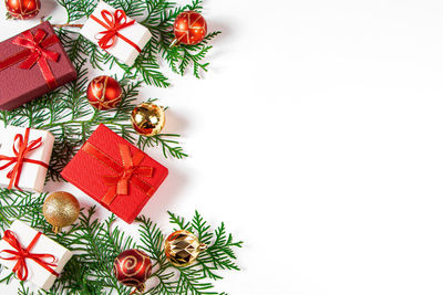 Directly above shot of christmas decorations on white background