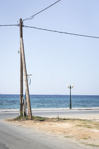 Lifeguard hut on beach against clear sky