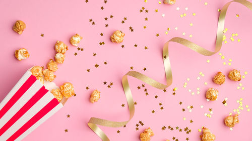 High angle view of pink petals on white background