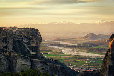 Scenic view of landscape against cloudy sky