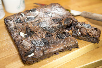 Chocolate cake on wooden table at home