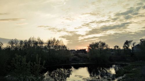 Scenic view of lake at sunset