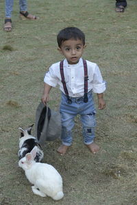 Full length of boy standing on field