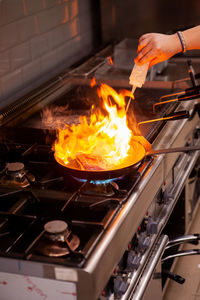 Cropped hand of person preparing food