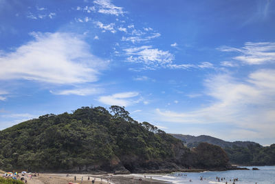 Scenic view of sea and mountains against sky