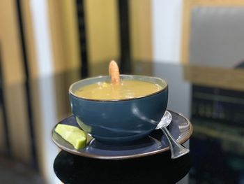 Close-up of coffee cup on table