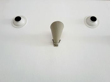 High angle view of coffee cup on white table