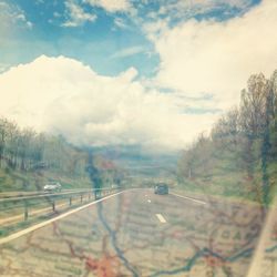 Scenic view of landscape against cloudy sky