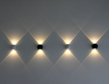 Low angle view of illuminated lighting equipment