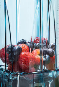 Close-up of fruits in glass container