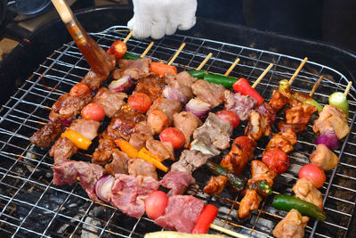 High angle view of meat on barbecue grill