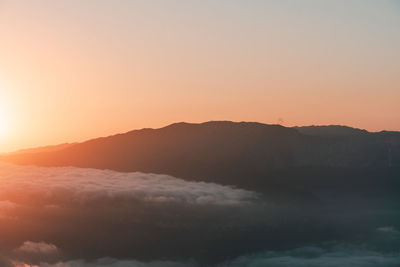 Scenic view of mountains against sky during sunset