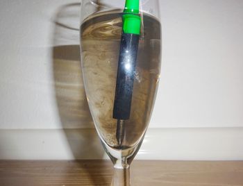 Close-up of wineglass on table
