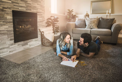 People sitting on sofa at home