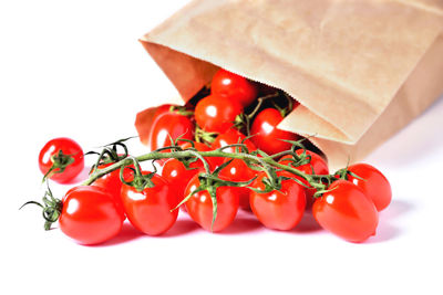 Close-up of tomatoes against white background