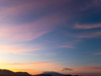 Low angle view of dramatic sky during sunset