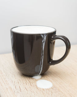 Close-up of coffee cup on table