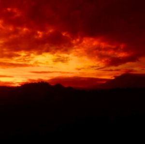 Scenic view of dramatic sky during sunset