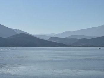 Scenic view of mountains against clear blue sky