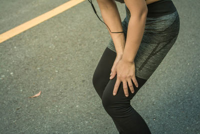 Low section of woman standing on ground