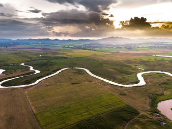 Scenic view of landscape against sky during sunset