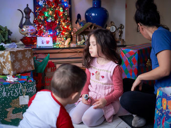 Family opening presents on christmas morning