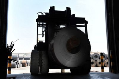 Close-up of machinery at construction site against sky